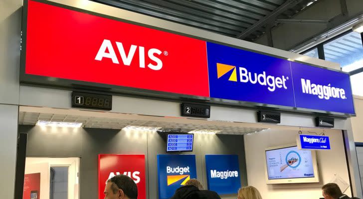 the avis logo displayed at an airport