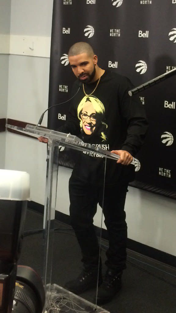 Drake turned up to Raptors-Warriors wearing a shirt with Doris Burke's face on it. (Image via @ewingsports)