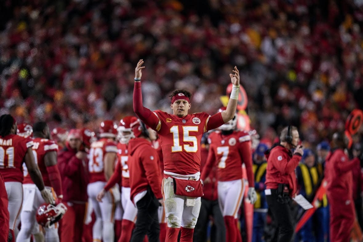 Kansas City Chiefs quarterback Patrick Mahomes (15) cheers during the second half of an NFL divisional round playoff football game against the Jacksonville Jaguars, Saturday, Jan. 21, 2023, in Kansas City, Mo. The Kansas City Chiefs won 27-20.(AP Photo/Jeff Roberson)