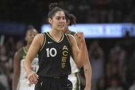 Las Vegas Aces guard Kelsey Plum (10) pumps her fist after scoring during the second half of a WNBA basketball game against the Seattle Storm, Sunday, Aug. 14, 2022, in Las Vegas. (AP Photo/Sam Morris)