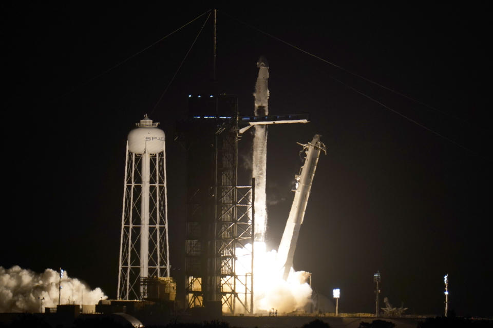 A SpaceX Falcon 9 rocket with the Crew Dragon space capsule lifts off from pad 39A at the Kennedy Space Center in Cape Canaveral, Fla., Friday, April 23, 2021. (AP Photo/John Raoux)