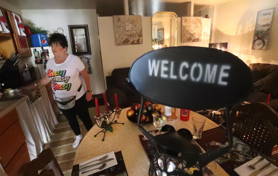 Jackie Wilkinson's unit at the Maley Apartments on Daytona Beach's downtown riverfront is tiny, but she has made it homey and keeps it very clean.