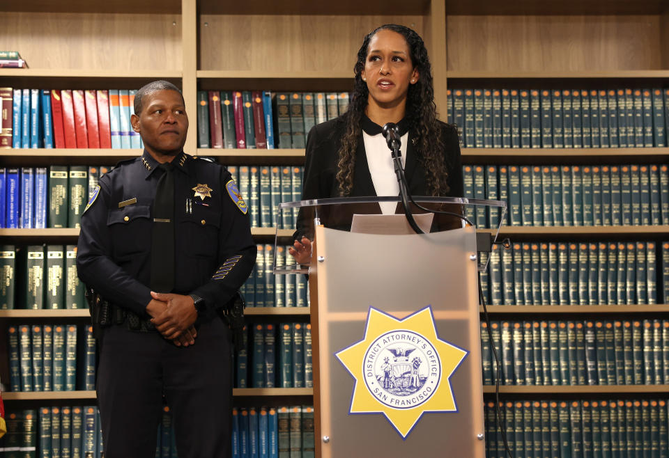San Francisco district attorney Brooke Jenkins speaks as San Francisco police chief Bill Scott looks on during a news conference on Oct. 31, 2022.