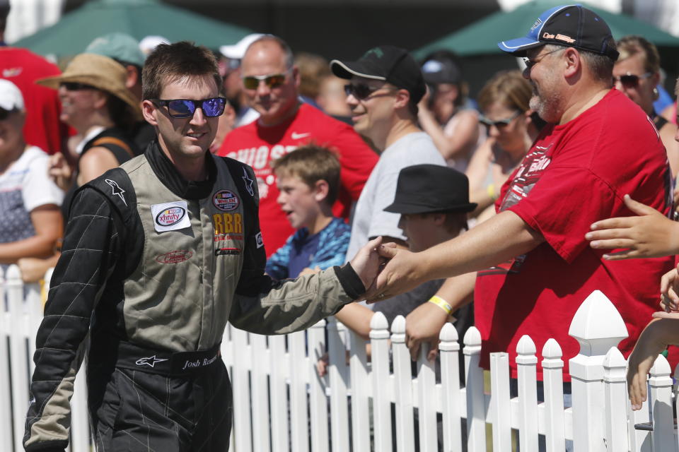 Josh Reaume is seen during driver introductions for the NASCAR Xfinity Series auto race at Mid-Ohio Sports Car Course Saturday, Aug. 15, 2015 in Lexington, Ohio. (AP Photo/Tom E. Puskar)