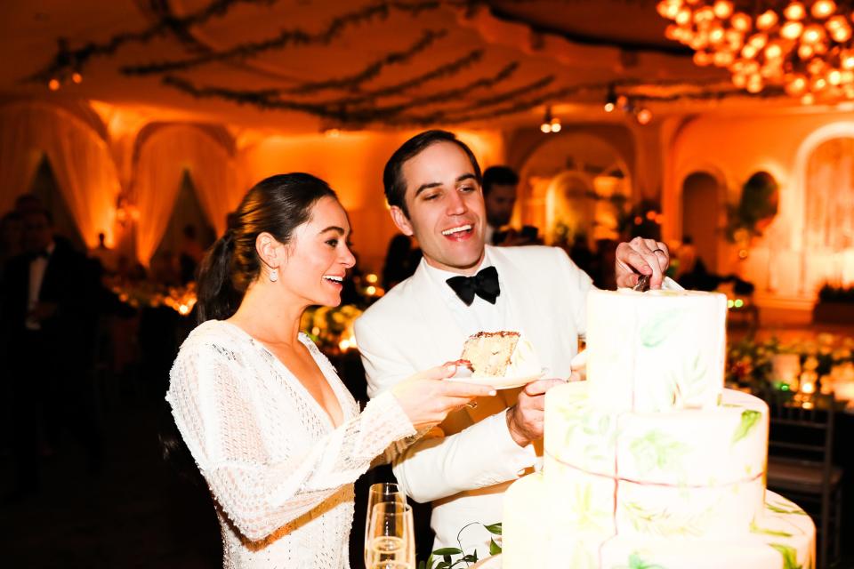 The bride wore Oscar de la Renta, inspired by her grandmother, for her greenery-filled ceremony at the Beverly Hills Hotel.