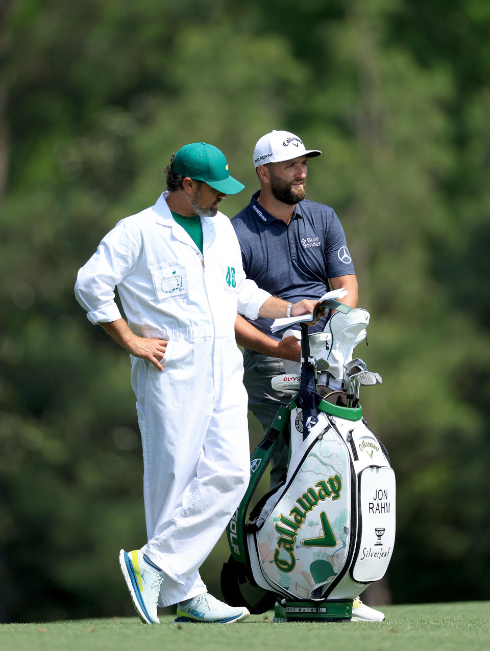 AUGUSTA, GEORGIA - APRIL 06: John Rahm of Spain prepares to play his second shot on the fifth hole with his caddie Adam Hayes during the first round of the 2023 Masters Tournament at Augusta National Golf Club on April 06, 2023 in Augusta, Georgia. (Photo by David Cannon/Getty Images)