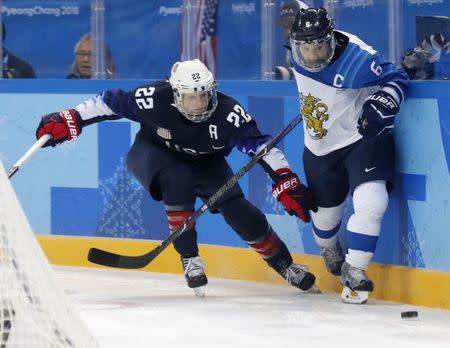 Ice Hockey - Pyeongchang 2018 Winter Olympics - Women's Semifinal Match - U.S. v Finland - Gangneung Hockey Centre, Gangneung, South Korea - February 19, 2018 - Kacey Bellamy of U.S. (L) and Jenni Hiirikoski of Finland in action. REUTERS/Kim Kyung-Hoon