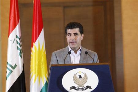 Iraq's Kurdistan Prime Minister Nechirvan Barzani speaks to the media after voting in Arbil, capital of the autonomous Kurdistan region, about 350 km (217 miles) north of Baghdad, September 21, 2013. REUTERS/Thaier Al-Sudani