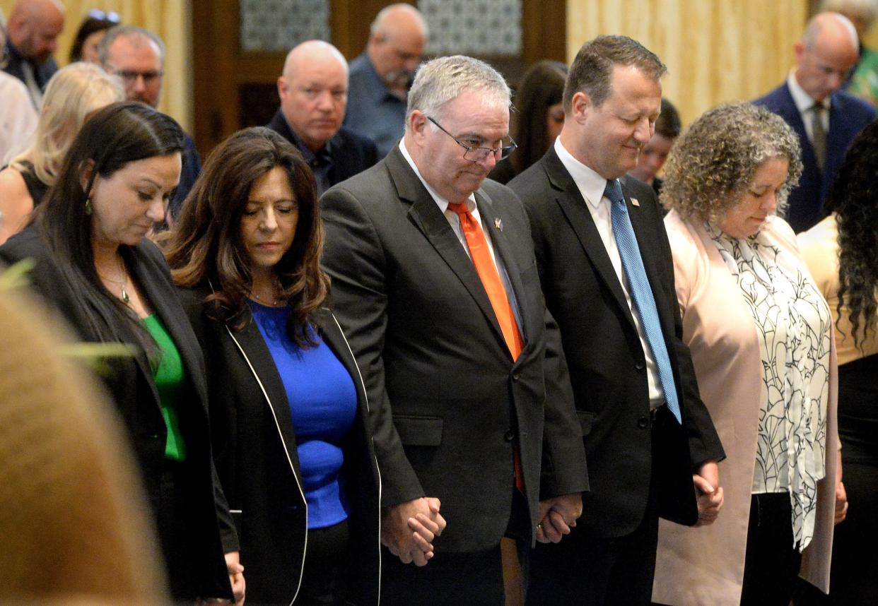 Mayor-Elect Misty Buscher, second from left, and other elected officials stand in front of the church for a blessing during an ecumenical prayer service at the Cathedral of the Immaculate Conception Friday, May 5, 2023.