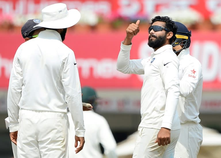 Indian bowler Ravindra Jadeja (2nd right) celebrates with teammates after he dismissed Nathan Lyon (unseen) during the second day of the third Test against Australia in Ranchi, on March 17, 2017