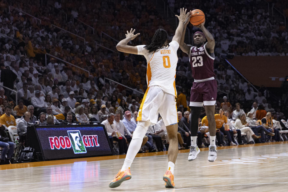 Texas A&M guard Tyrece Radford (23) shoots over Tennessee forward Jonas Aidoo (0) during the second half of an NCAA college basketball game Saturday, Feb. 24, 2024, in Knoxville, Tenn. (AP Photo/Wade Payne)