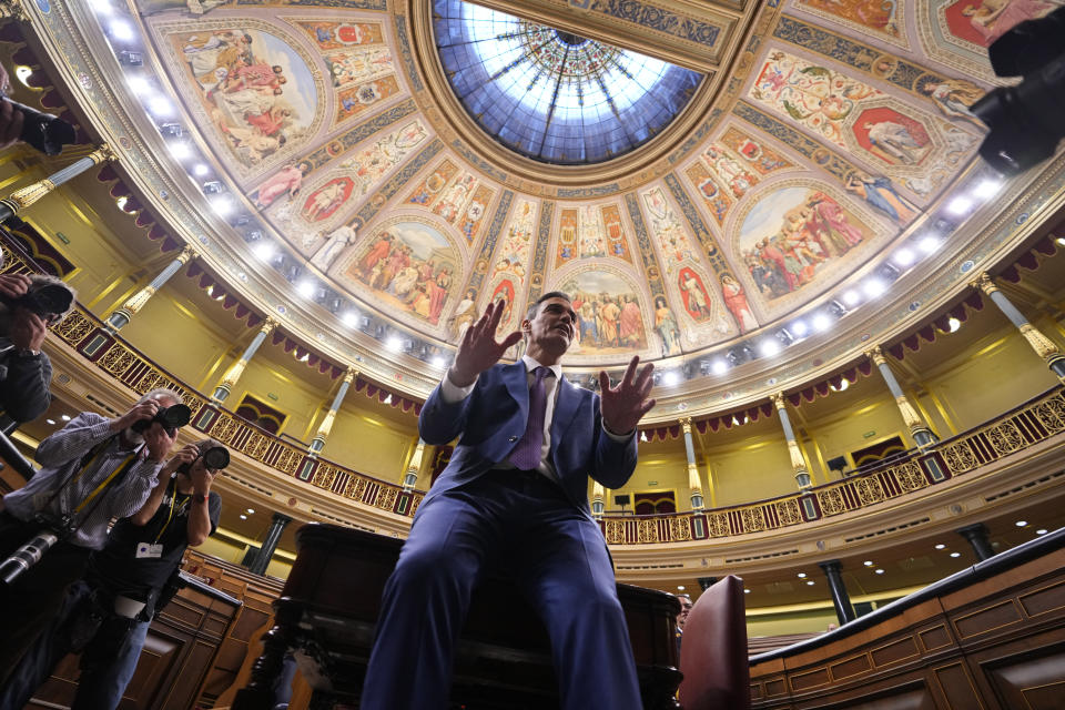 Spain's acting Prime Minister Pedro Sanchez poses for photographers after he was chosen by a majority of legislators to form a new government after a parliamentary vote at the Spanish Parliament in Madrid, Spain, Thursday, Nov. 16, 2023. (AP Photo/Manu Fernandez)