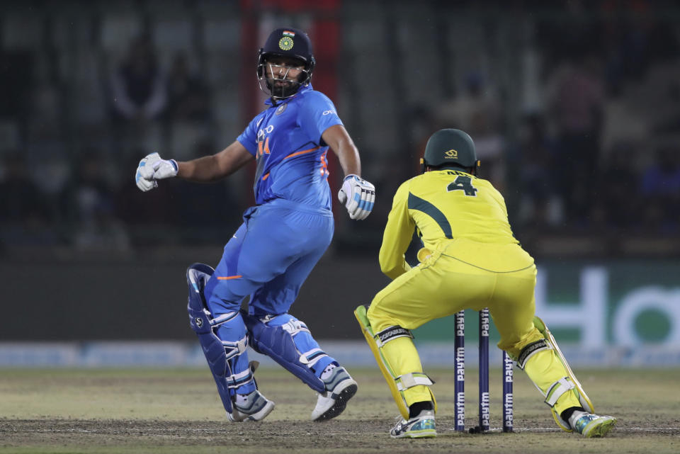 India's Rohit Sharma is stumped out after he lost grip of his bat while playing a shot during the final one day international cricket match between India and Australia in New Delhi, India, Wednesday, March 13, 2019. (AP Photo/Altaf Qadri)