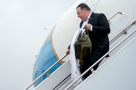 U.S. Secretary of State Mike Pompeo arrives at Yokota Air Force Base in Fussa, Japan, Friday, July 6, 2018, for a refueling stop on his way to Pyongyang, North Korea. Andrew Harnik/Pool via Reuters