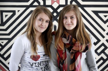 Twins Dzenisa (R) and Merisa Kaukovic pose for a portrait at a secondary school in Buzim, April 2, 2015. REUTERS/Dado Ruvic