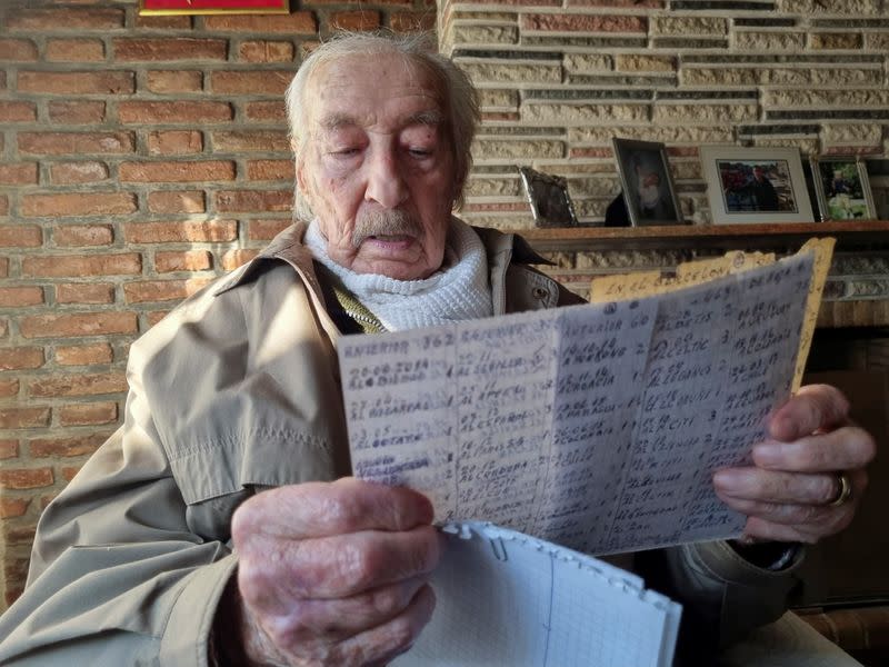 Hernan Mastrangelo, a 100-year-old fan of Lionel Messi, writes down all of Messi's goals in his notebook in Buenos Aires