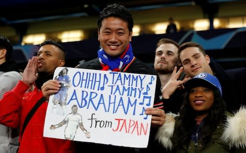 A fan holds a sign referencing Chelsea's Tammy Abraham - Credit: Reuters