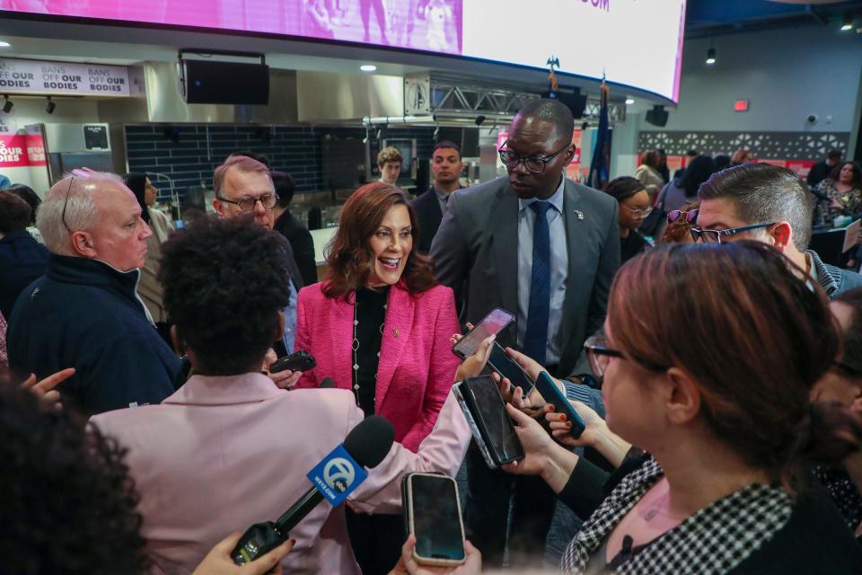 Michigan Gov. Gretchen Whitmer speaks to the press after holding a press conference to sign the Reproductive Health Act alongside lawmakers and activists at Schoolcraft College in Livonia, Mich. on Tuesday, Nov. 21, 2023. Whitmer signed legislation creating a 100% clean energy generation standard in Michigan by 2040 on Tuesday, Nov. 28, 2023.