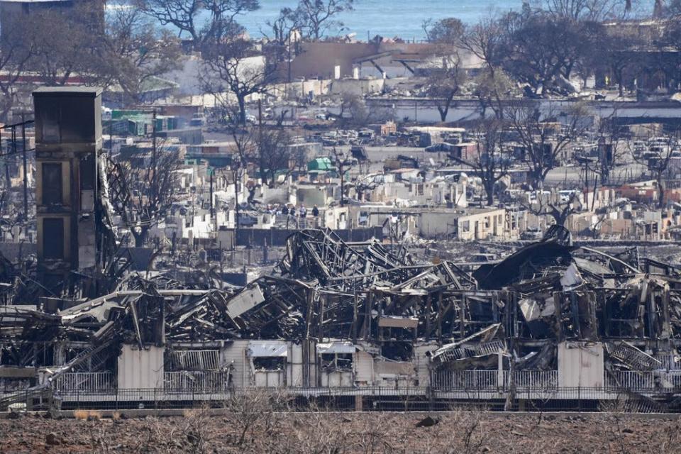 Burned houses and buildings are seen in Lahaina. Thousands were displaced after a wildfire fueled by winds from Hurricane Dora and dry vegetation destroyed much of the town. The death toll from the fire makes it the deadliest wildfire of the past U.S. century.
