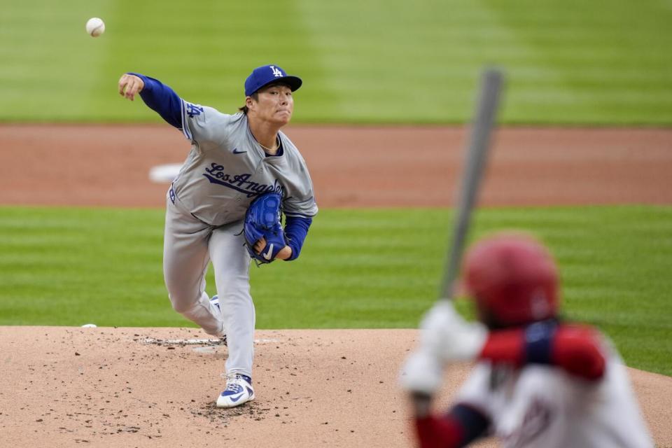 Yoshinobu Yamamoto delivers a pitch against the Washington Nationals