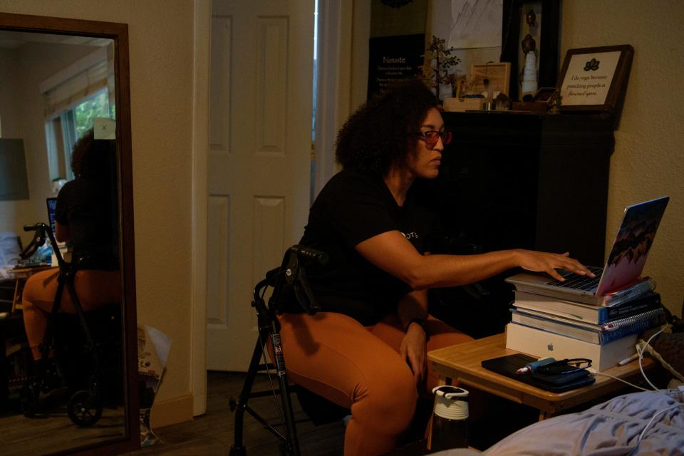 Liza Fisher enters data into a spreadsheet, which she created to track her symptoms and identify their triggers, at her home in Houston on Sept. 5.