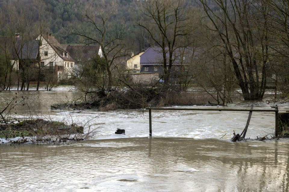 The flooding of the Steinach river reaches the first buildings in Horb an der Steinach, Germany, Wednesday, Jan. 3, 2024. (Pia Bayer/dpa via AP)