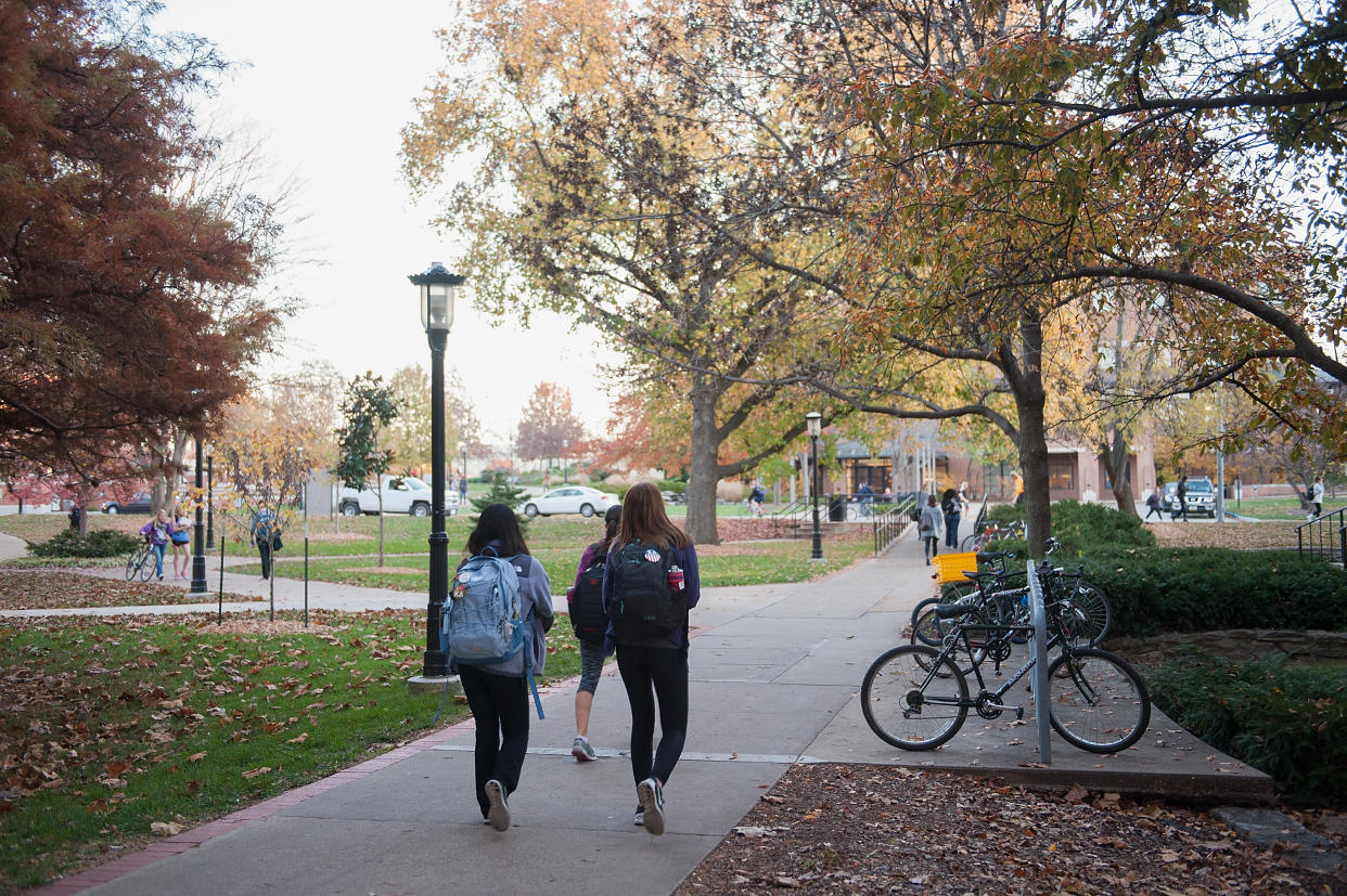 Students walk across the campus of the University of Missouri, where a grad student was suspended for sexually harassing and stalking a female classmate. (Photo: Getty Images)