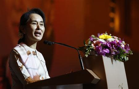 Myanmar's opposition leader Aung San Suu Kyi speaks to the Myanmar community living in Singapore on the island of Sentosa in Singapore September 22, 2013. REUTERS/Edgar Su