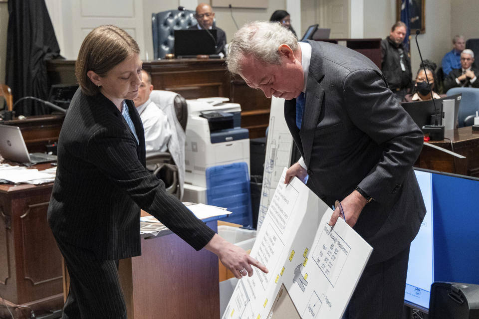 Melinda Worley, SLED foot and tire tread expert, points to section of a crime scene diagram to defense attorney Dick Harpootlian during Alex Murdaugh's trial for murder at the Colleton County Courthouse on Monday, Jan. 30, 2023. Monday, Jan. 30, 2023. (Joshua Boucher/The State via AP, Pool)