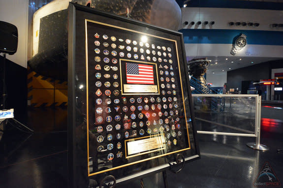 — United Space Alliance's framed space shuttle mission pin collection, as presented to Space Center Houston on June 18, 2014.