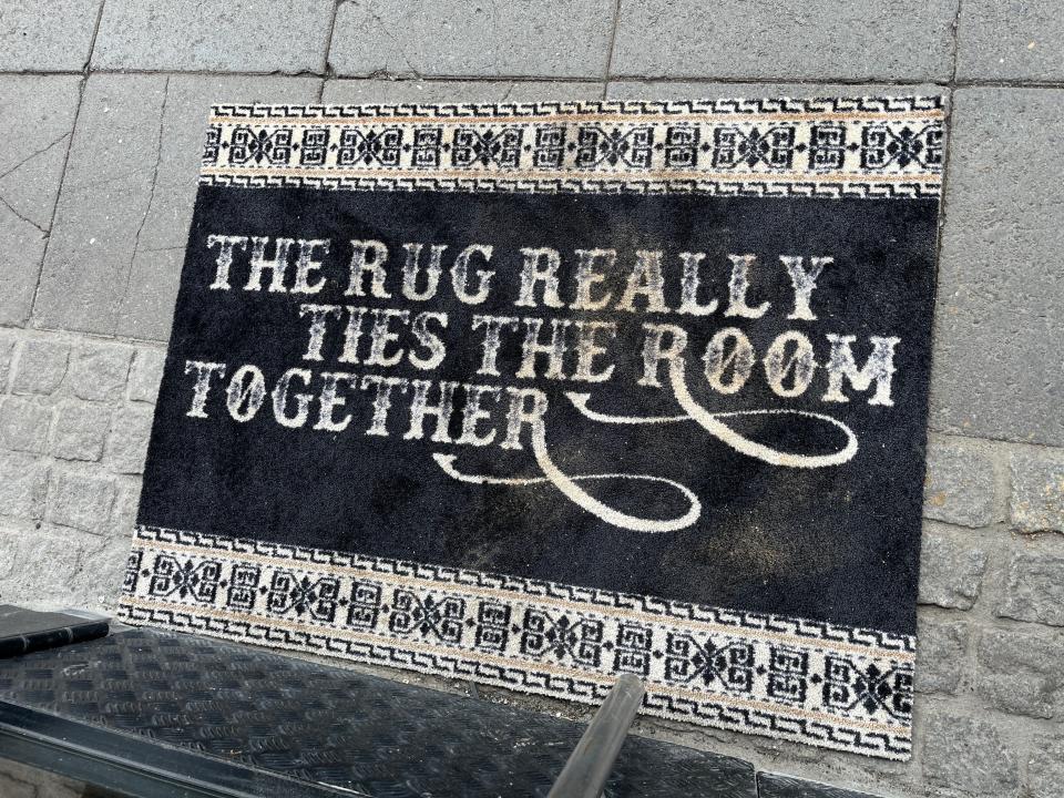 A rug outside Lebowski Bar in Iceland.