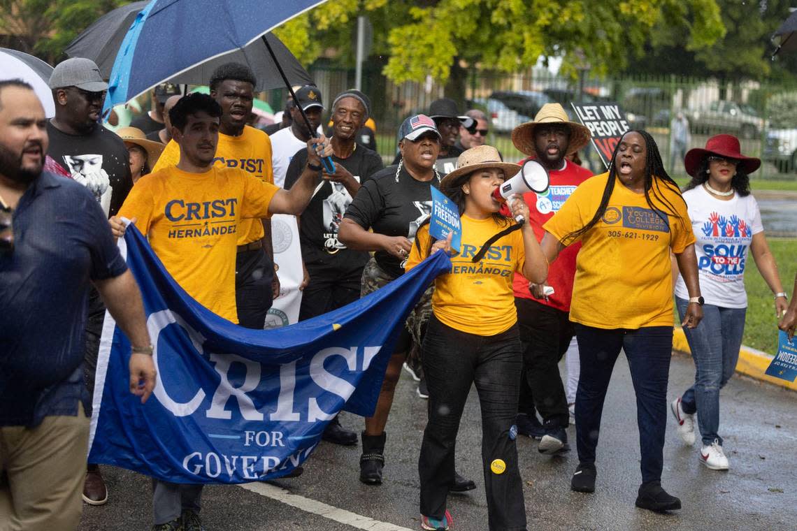 Karla Hernandez-Mats, the Democratic candidate for lieutenant governor, leads the march through the rain during a Souls to the Polls event on Sunday, Nov. 6, 2022, in Liberty City. The march started at the African Heritage Cultural Arts Center and ended at the Joseph Caleb Center, an early voting location. Alie Skowronski/askowronski@miamiherald.com