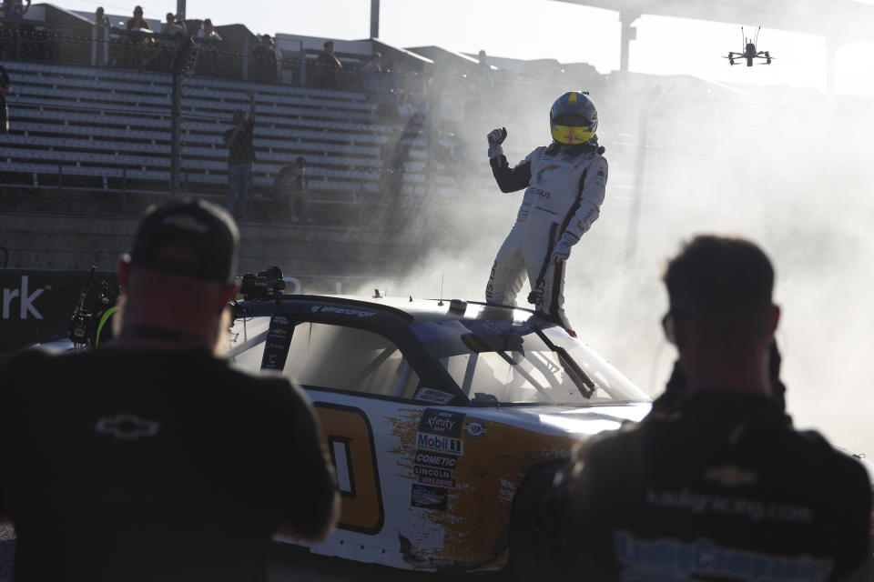 AJ Allmendinger celebrates after winning a NASCAR Xfinity Series auto race at Circuit of the Americas, Saturday, March 25, 2023, in Austin, Texas. (AP Photo/Stephen Spillman)