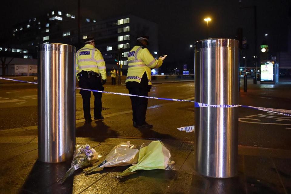 Terror attack: Flowers placed below a police cordon on Westminster Bridge (REUTERS)