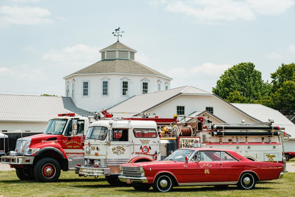 Vintage fire department apparatus can be seen parked next to a truck from the Hartville Fire Department during the fourth annual HRN Firefighter Field Day, Saturday, June 10 at the Tuscarawas County Fairgrounds in Dover. Proceeds from the event went to benefit the Akron Children’s Hospital Burn Camp program.
