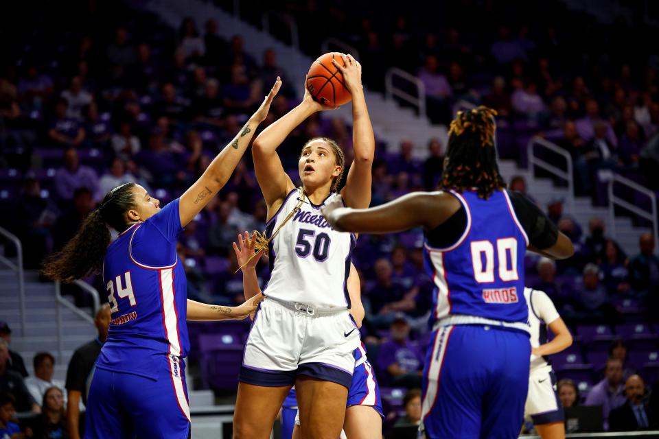 Kansas State centere Ayoka Lee (50) puts up a shot in the lane against Presbyterian in the season opener on Nov. 6, 2023 at Bramlage Coliseum in Manhattah.