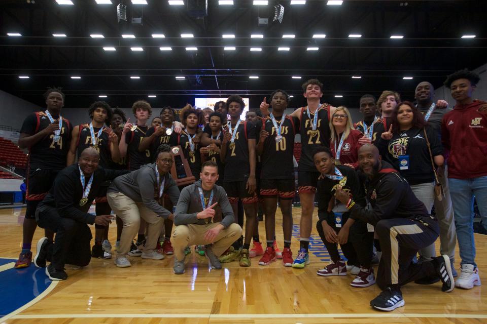 Florida High players and coaches pose following the Seminoles state championship win over Riviera Prep on March 4, 2022, at R.P. Funding Center in Lakeland.