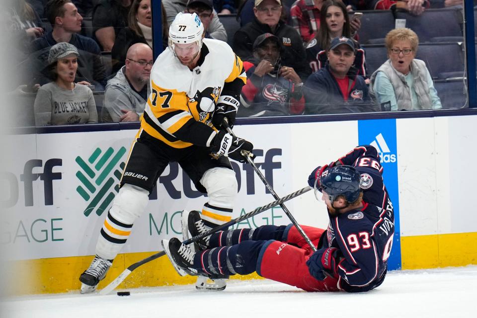 Oct 22, 2022; Columbus, Ohio, USA;  Columbus Blue Jackets forward Jakub Voracek (93) fights for the puck with Pittsburgh Penguins forward Jeff Carter (77) during the first period of the hockey game between the Columbus Blue Jackets and the Pittsburgh Penguins at Nationwide Arena. Mandatory Credit: Joseph Scheller-The Columbus Dispatch