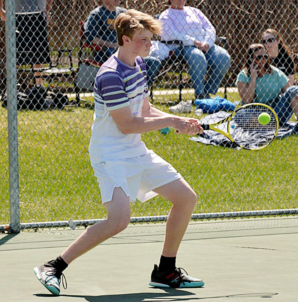 Watertown's Curtis Sneden smacks a backhand return during a high school boys tennis dual against Mitchell on Friday, May 5, 2023 at Highland Park.