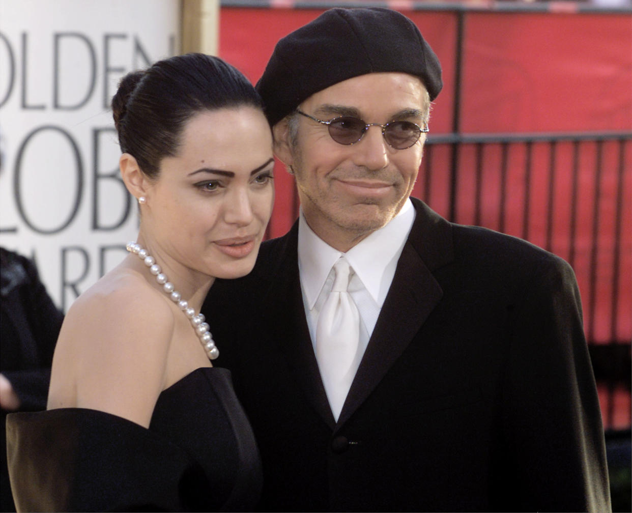 Billy Bob Thornton (R) and actress wife Angelina Jolie pose during  arrivals at the 59th annual Golden Globe Awards in Beverly Hills,  January 20, 2002. Thornton is nominated for Best Actor in a Motion  Picture - Drama, and Comedy or Musical categories. REUTERS/Fred  Prouser    JH/SV