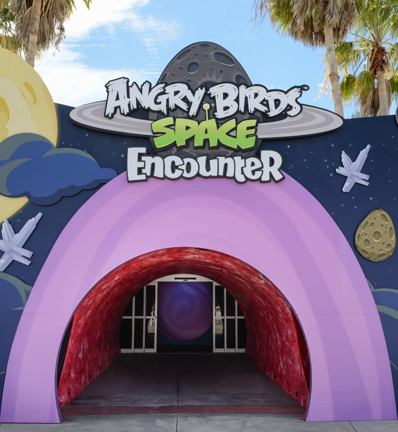 This March 22, 2013 photo released by Delaware North shows the main entrance to Angry Birds Space Encounter at the Kennedy Space Center Visitor Complex in Cape Canaveral, Fla. The online game Angry Birds is the inspiration for the new attraction at the space center, where most of the exhibits focus on space exploration and NASA history. (AP Photo/Delaware North, Joe Cascio)