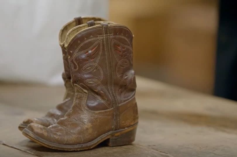 The little cowboy boots were in desperate need of repairing -Credit:BBC