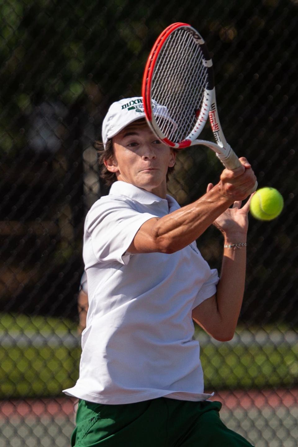 Duxbury senior 2nd singles player Colby Hall returns a shot from Hopkinton's Adam Glace, during the Division 2 state semifinal at Lexington High, June 15, 2023.