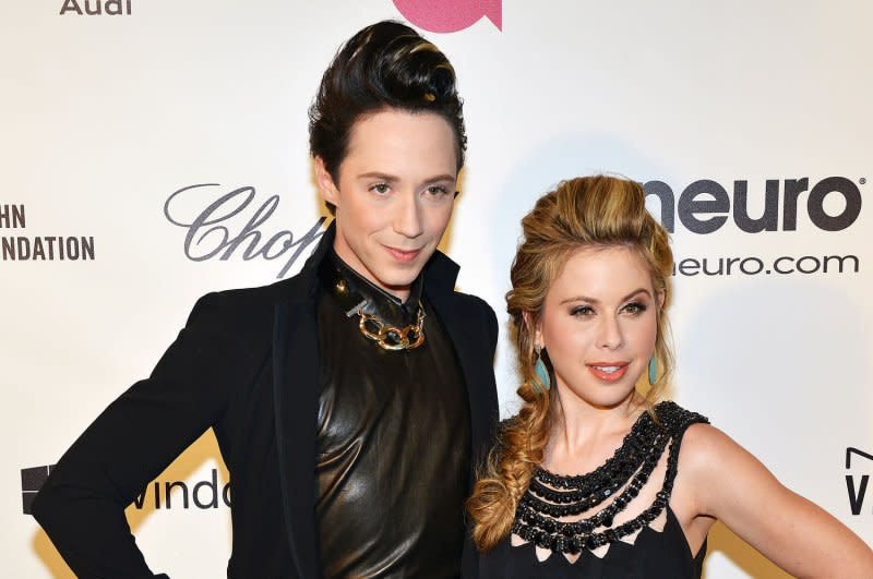 Tara Lipinski (R) and Johnny Weir attend the Elton John AIDS Foundation Academy Awards viewing party in 2014. File Photo by Christine Chew/UPI