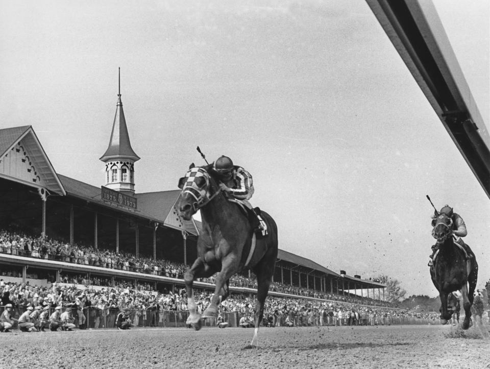 FILE - Secretariat, with jockey Ron Turcotte up, passes the twin spires of Churchill Downs during the running of the 99th Kentucky Derby in Louisville, Ky. on May 5, 1973. (AP Photo/File)