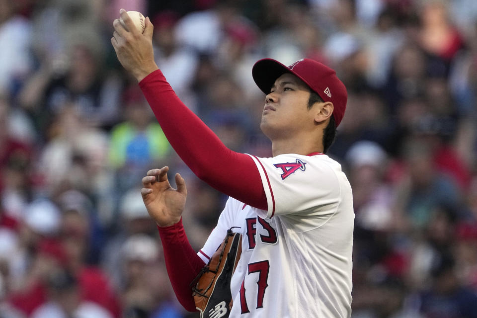 Los Angeles Angels starting pitcher Shohei Ohtani checks the ball during the second inning of a baseball game against the Chicago White Sox Tuesday, June 27, 2023, in Anaheim, Calif. (AP Photo/Mark J. Terrill)
