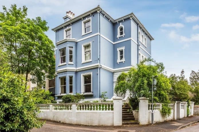 A five-bedroom Victorian home with a pale blue exterior in Dorking