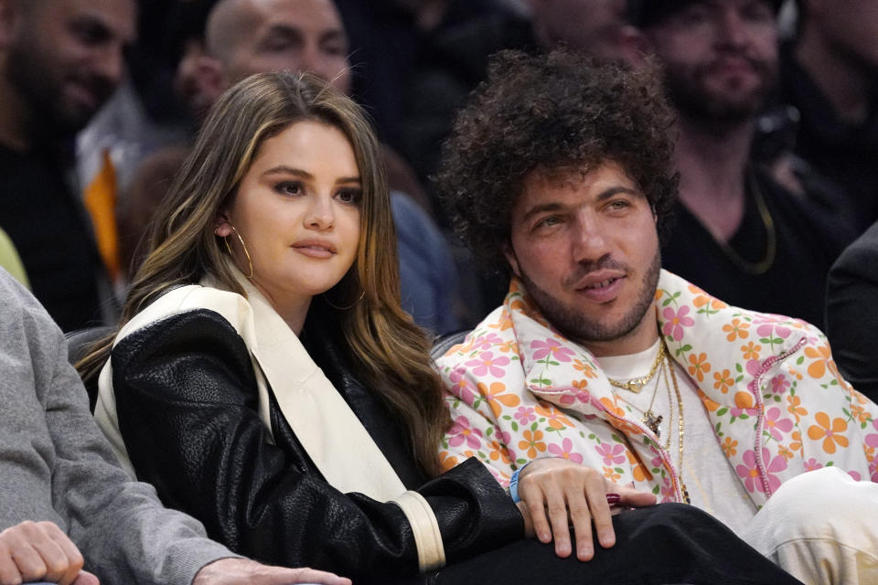 Actress Selena Gomez, left, and actor Benny Blanco watch during the first half of an NBA basketball game between the Los Angeles Lakers and the Miami Heat on Wednesday, Jan. 3, 2024, in Los Angeles. (AP Photo/Mark J. Terrill)