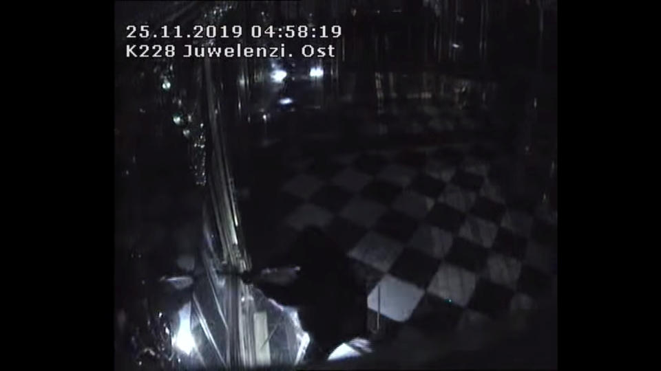 Thieves with torches and tools break into one of the display cabinets in Green Vault museum in Dresden, Germany, November 25, 2019 in this still image taken from a security video. Saxony Police Department/Handout via REUTERS   THIS IMAGE HAS BEEN SUPPLIED BY A THIRD PARTY.