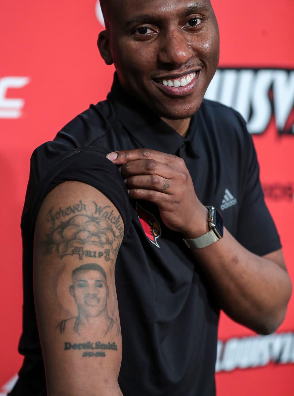 Nolan Smith shows off the tattoo of his father Derek on his right arm after Smith's introductory press conference Monday afternoon. April 11, 2022